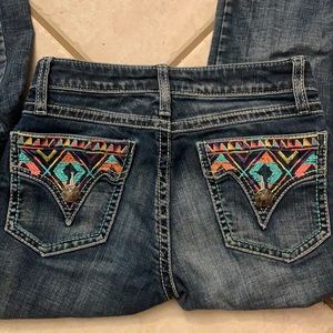 Wrangler Rock 47’s, slightly worn, good condition.